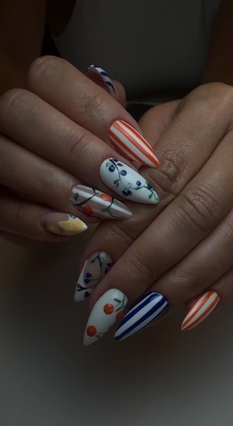 Hand-painted almond gel nails with orange and navy stripes, blueberry vines and lemon accents at Paradisse Studio, Richmond Hill