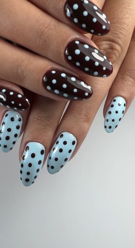 Almond gel nails in dark chocolate and baby blue with hand-placed polka dots at Paradisse Studio, Richmond Hill