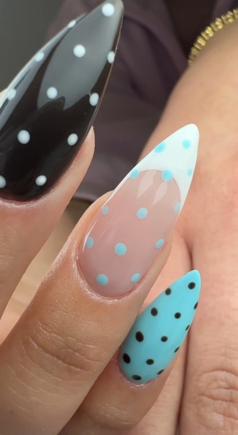 Stiletto nails in black, baby blue and sheer pink with playful polka dots and a French tip at Paradisse Studio, Richmond Hill