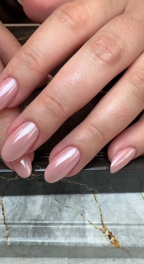 Sheer pink almond gel manicure with a pearl chrome finish at Paradisse Studio, Richmond Hill