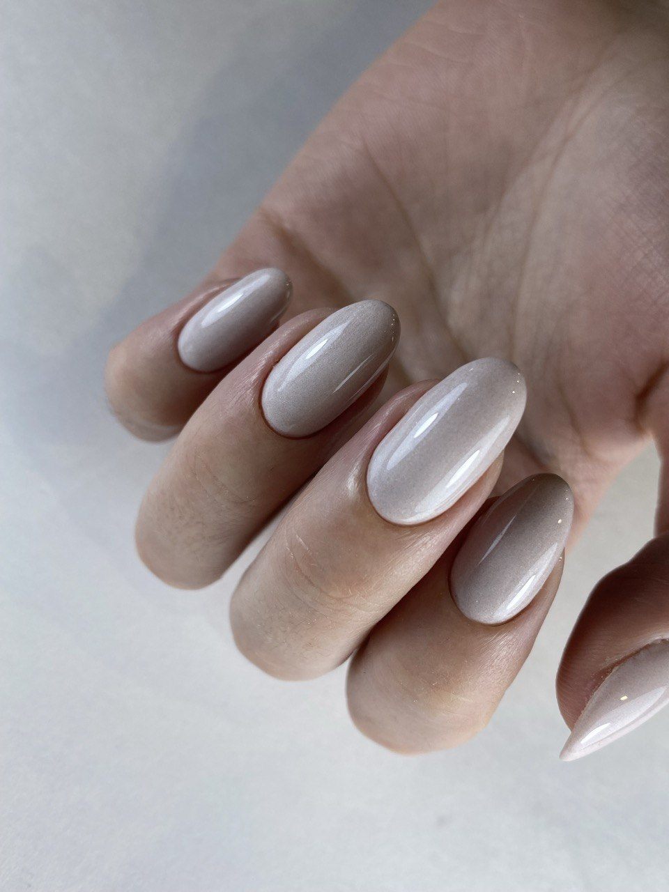 Almond gel manicure in a soft shimmering nude-taupe at Paradisse Studio, Richmond Hill
