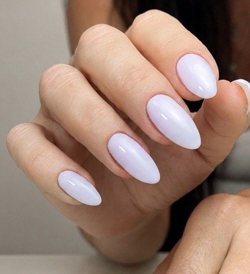 Milky white almond gel nails with a soft pearl finish at Paradisse Studio, Richmond Hill